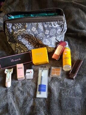 Gray Floral Makeup Organizer Bag with Assorted Beauty Items